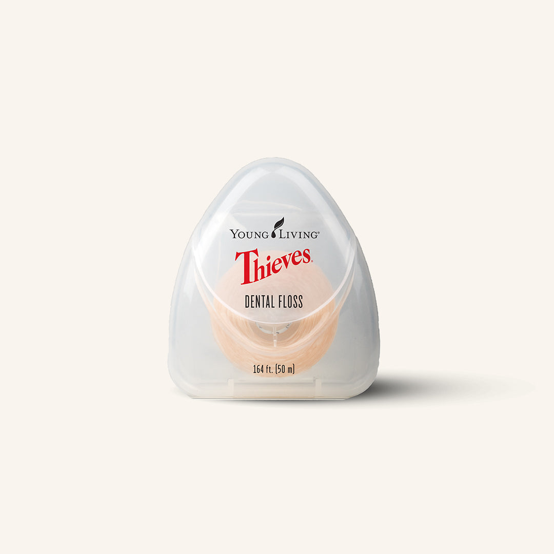 Young Living Thieves® Dental Floss van 50 meter, verrijkt met de Thieves®-blend en pepermuntolie voor dagelijkse mondverzorging.
